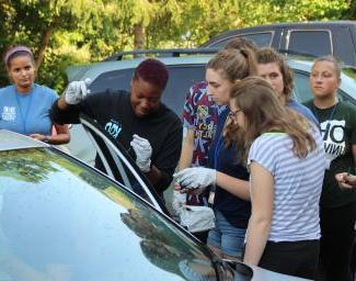 Students around a car